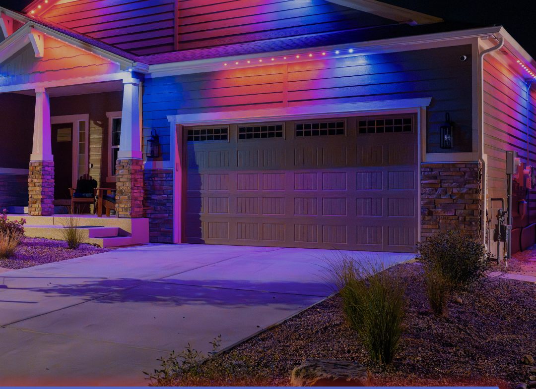 The same home's front lit in red, white, and blue